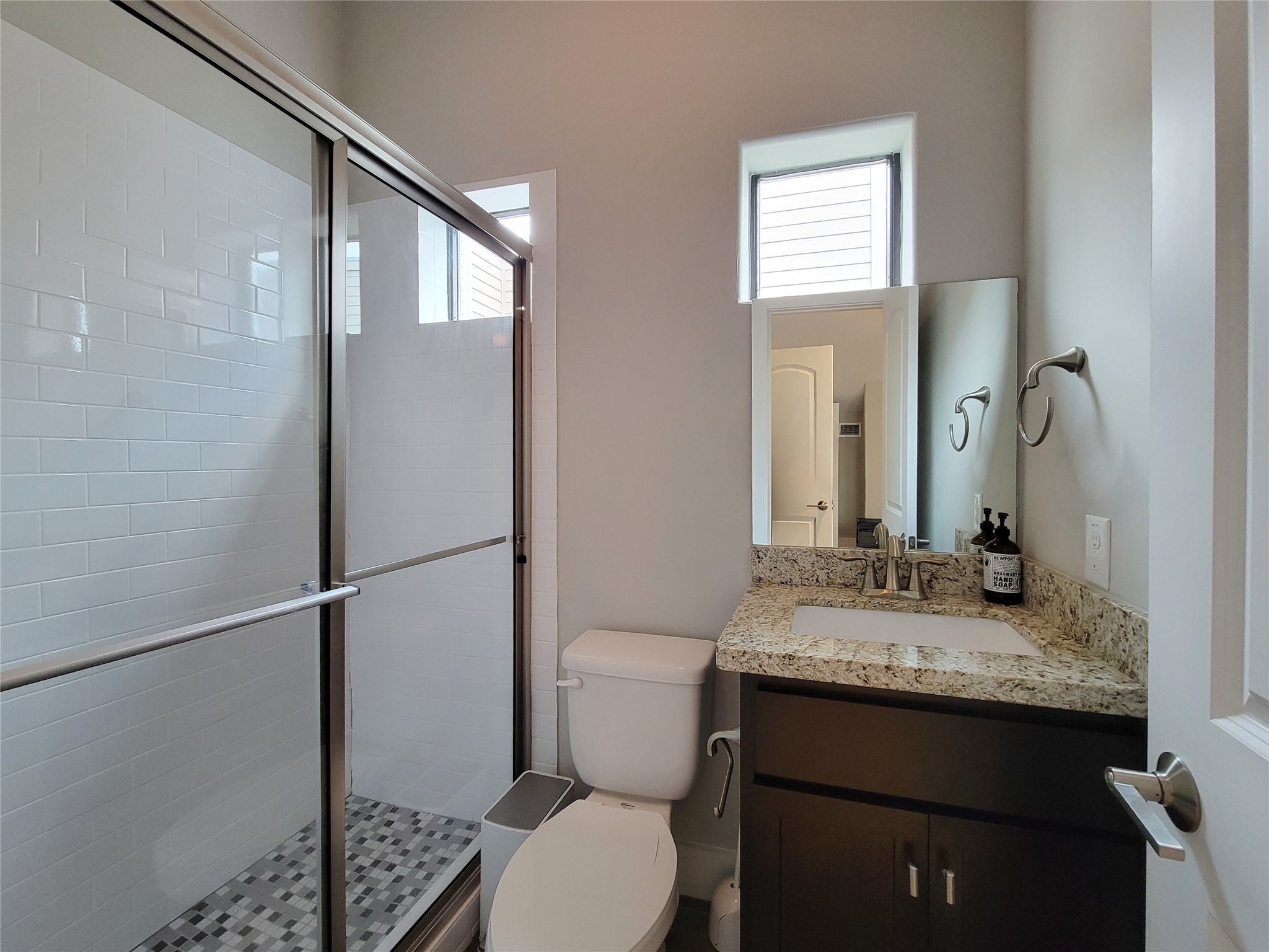 1424 Wilson Street Houston, TX 77019 - Photo 43 of 47 a bathroom with a granite countertop sink toilet and shower