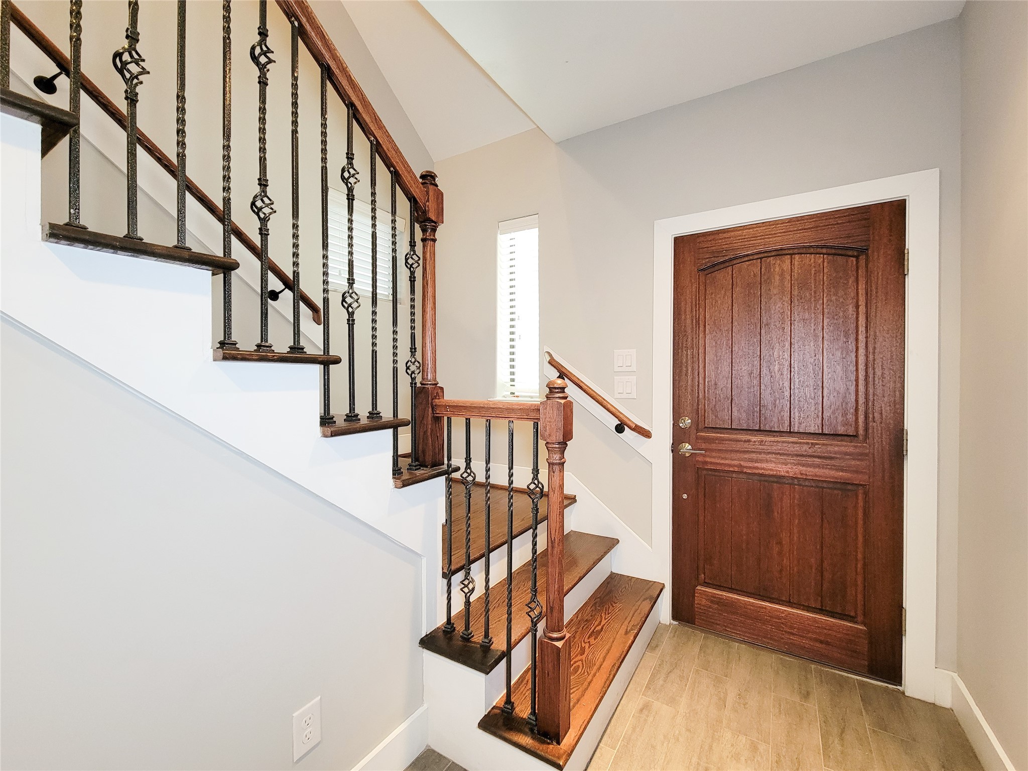 1424 Wilson Street Houston, TX 77019 - Photo 5 of 47 a view of entryway with wooden floor and stairs