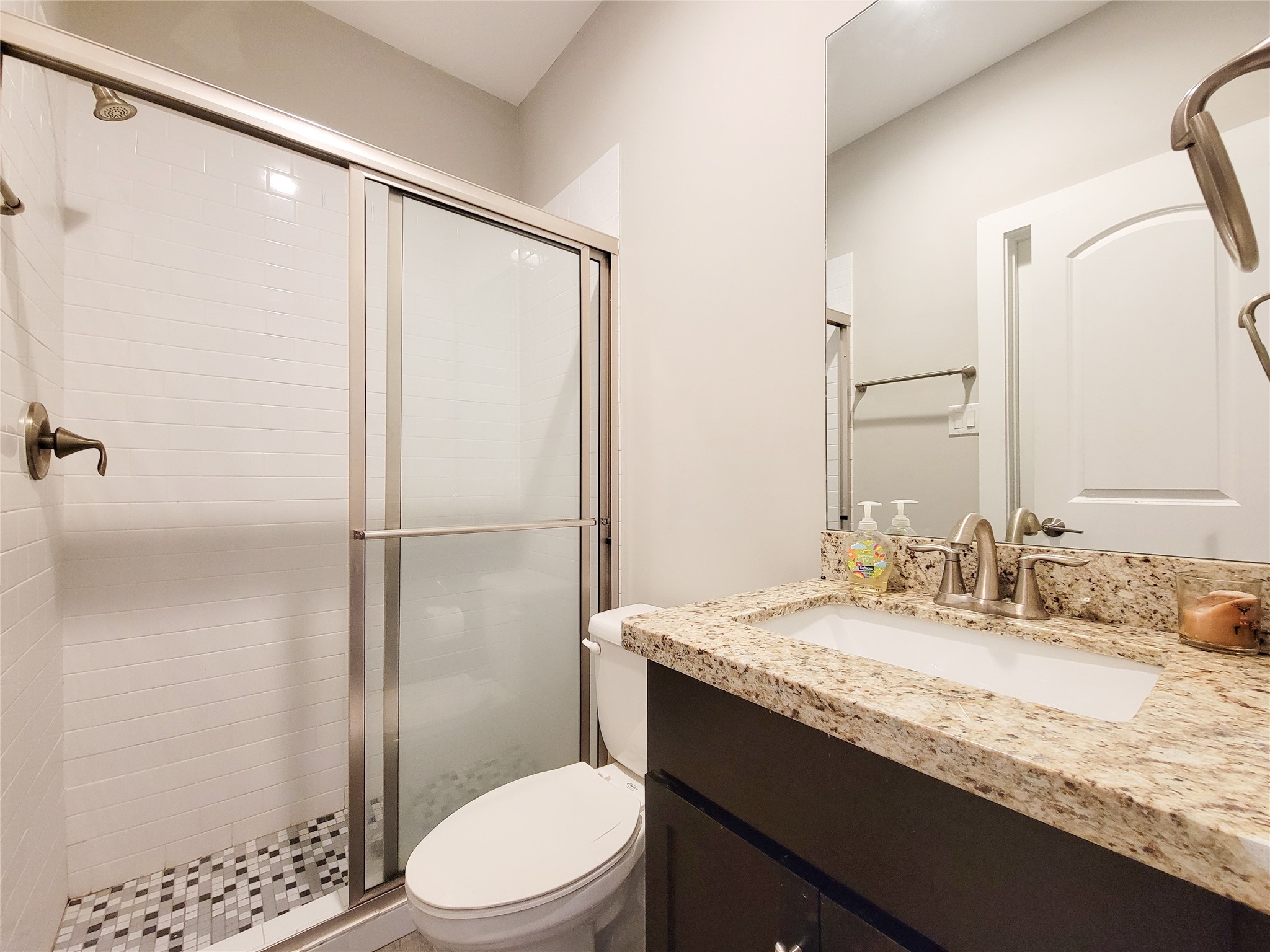 1424 Wilson Street Houston, TX 77019 - Photo 8 of 47 a bathroom with a granite countertop sink toilet and shower