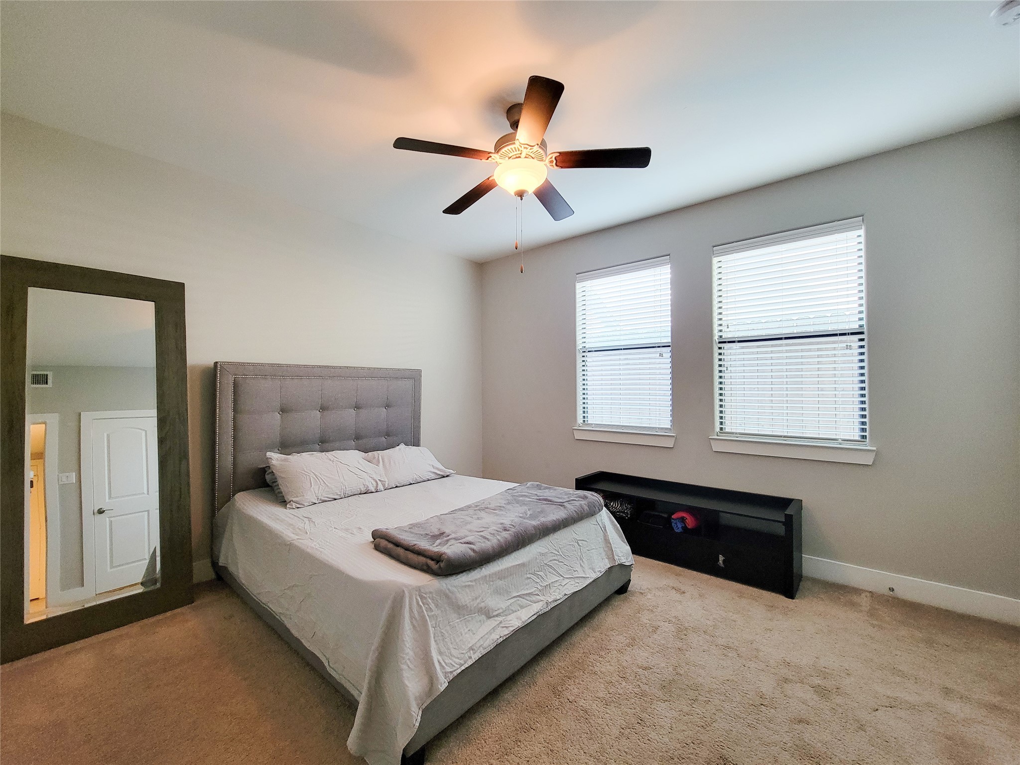 1424 Wilson Street Houston, TX 77019 - Photo 10 of 47 a bedroom with a bed and window