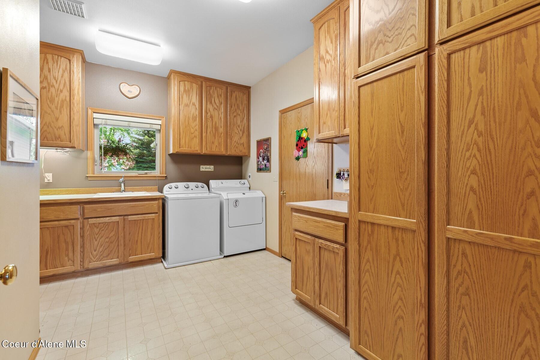1655 West Diamond Bar Road Rathdrum, ID 83858 - Photo 23 of 55 Laundry Room, Abundant Cabinetry