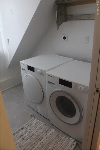 a utility room with dryer and washer