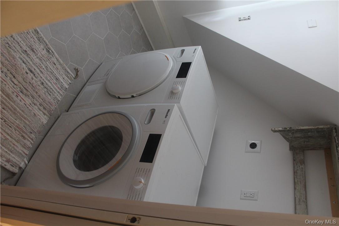 17 Gold Dan Road, Unit 56C Swan Lake, NY 12783 - Photo 17 of 33 a utility room with dryer and washer