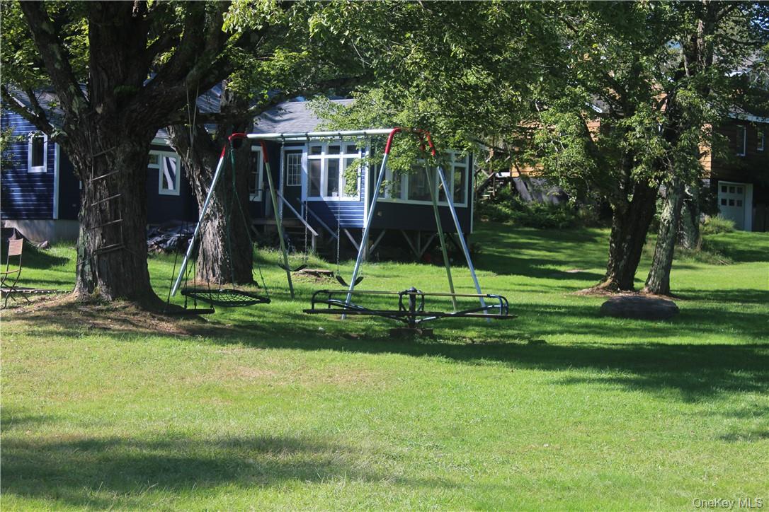 17 Gold Dan Road, Unit 56C Swan Lake, NY 12783 - Photo 27 of 33 a view of a park with a slide
