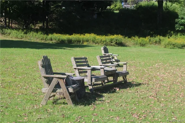 a view of a lake with outdoor seating