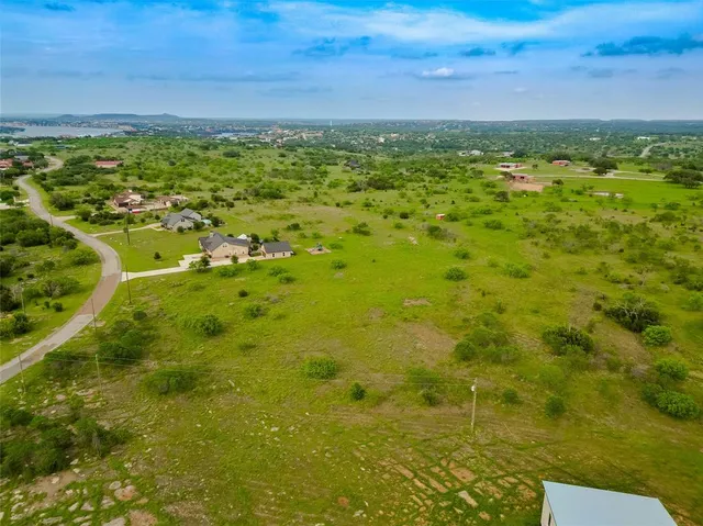a view of a yard with an outdoor seating