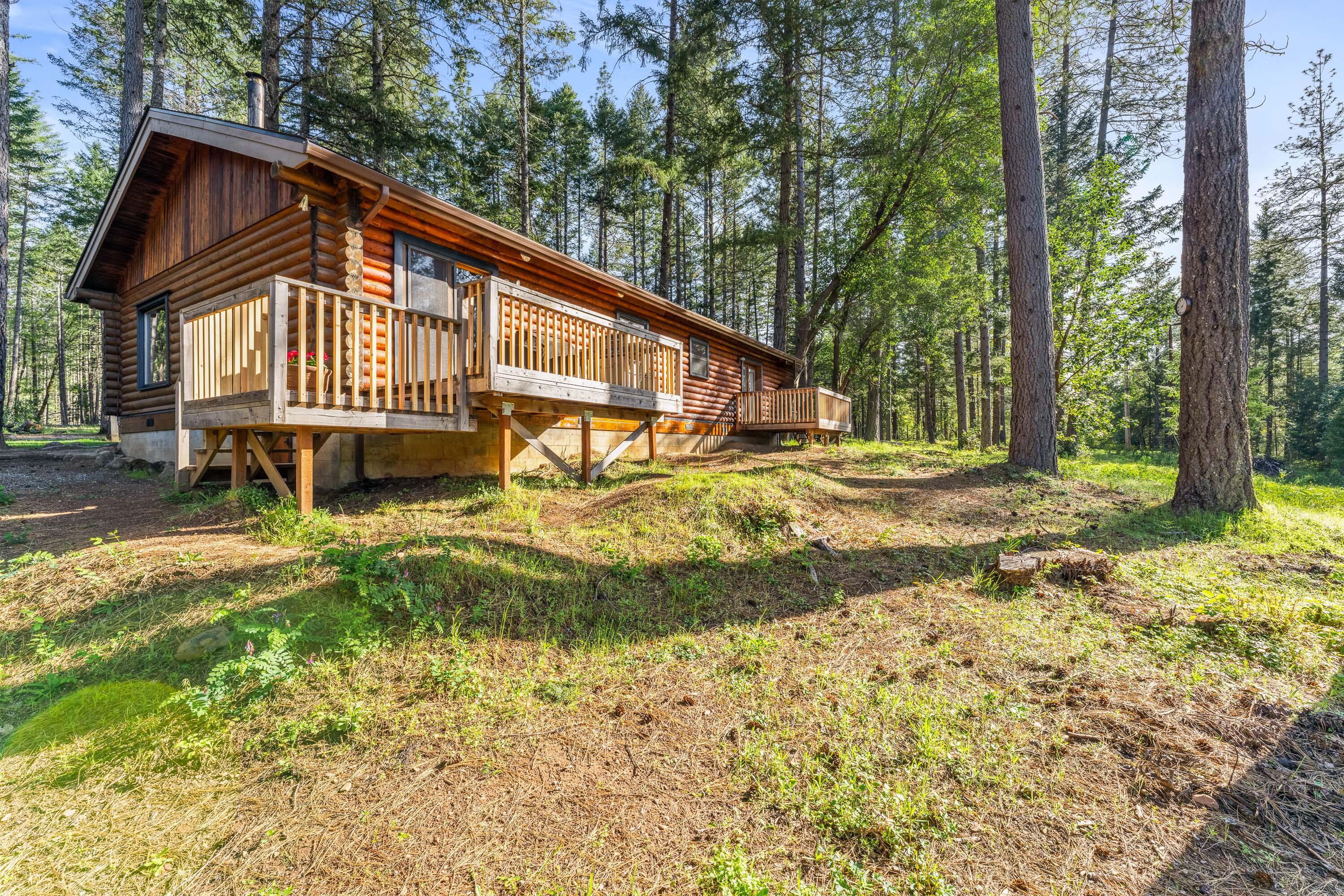 1201 Reeves Creek Road Selma, OR 97538 - Photo 23 of 38 a view of a house with a yard