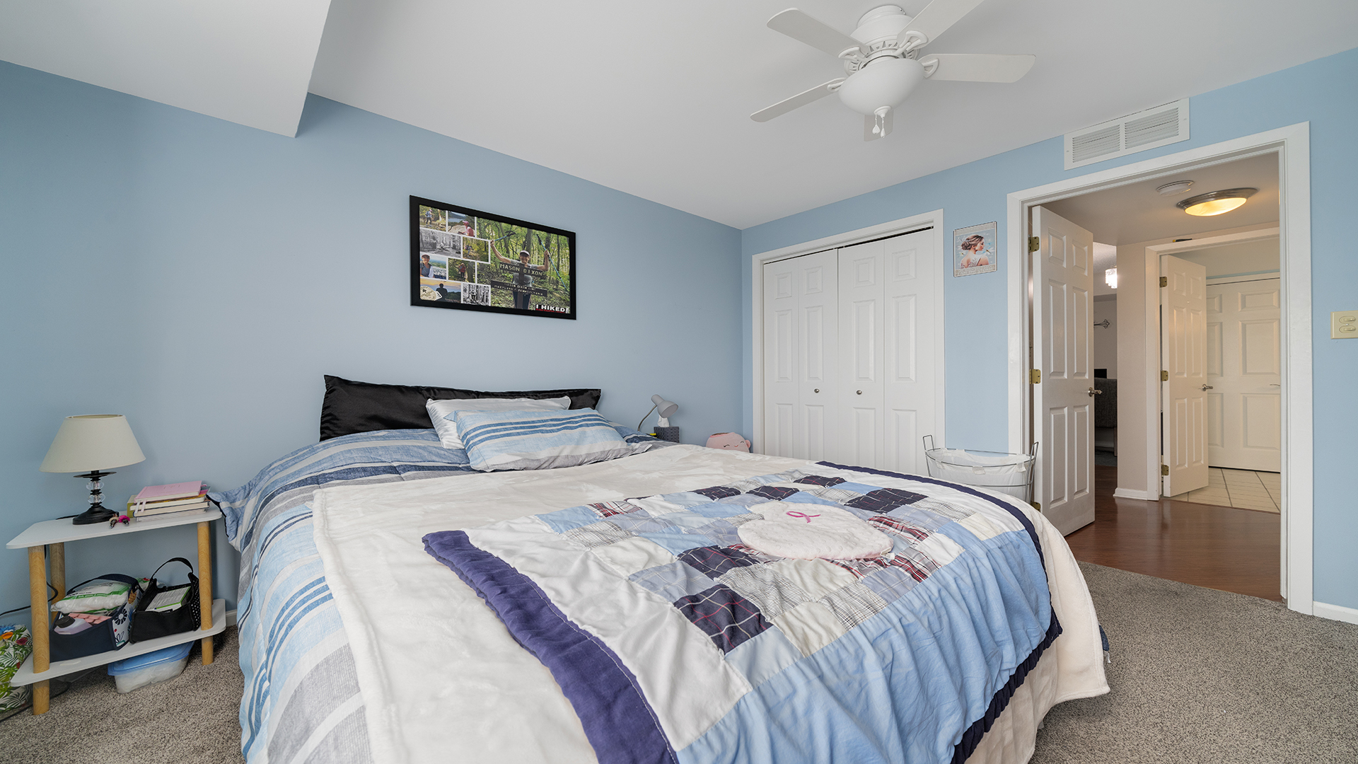 1133 North 7th Street, Unit 704 Rochelle, IL 61068 - Photo 24 of 31 a bedroom with a bed and a chandelier