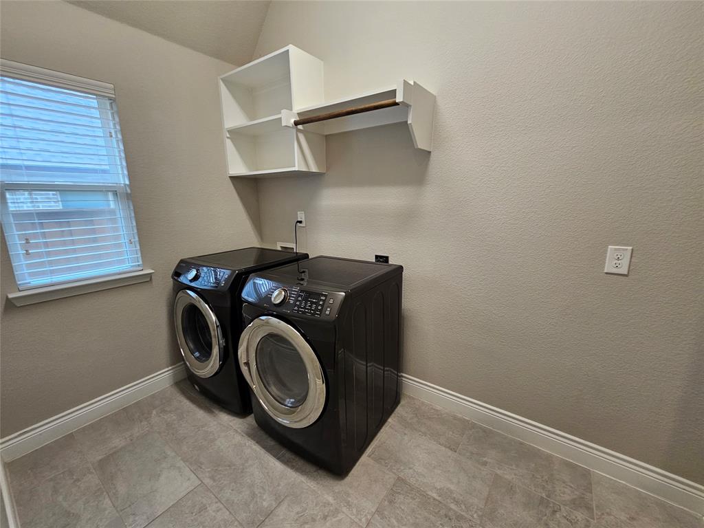 2065 Snapdragon Road Frisco, TX 75033 - Photo 21 of 39 Dedicated utility space featuring tile flooring, a single window with blinds, and built-in shelving with a hanging rod