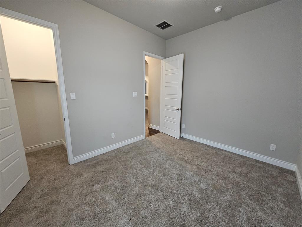 2065 Snapdragon Road Frisco, TX 75033 - Photo 22 of 39 Neutral-toned carpeting throughout