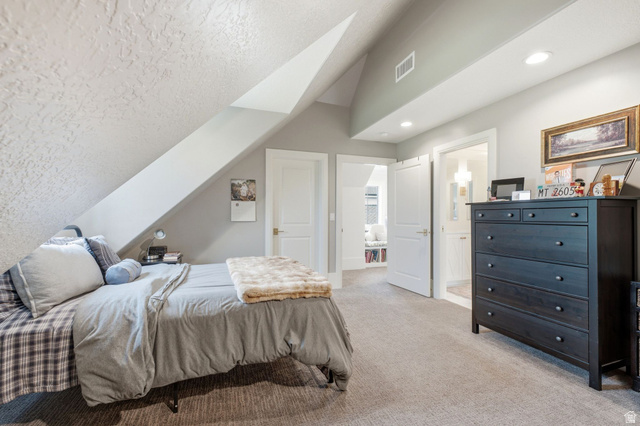 71 Farm Road Midway, UT 84049 - Photo 59 of 92 Carpeted room featuring a sloped ceiling, recessed lighting, white trim, and a doorway to an additional space