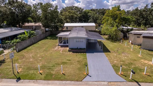 a view of a swimming pool with a patio