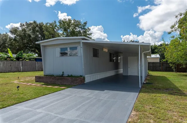 a view of a backyard of the house