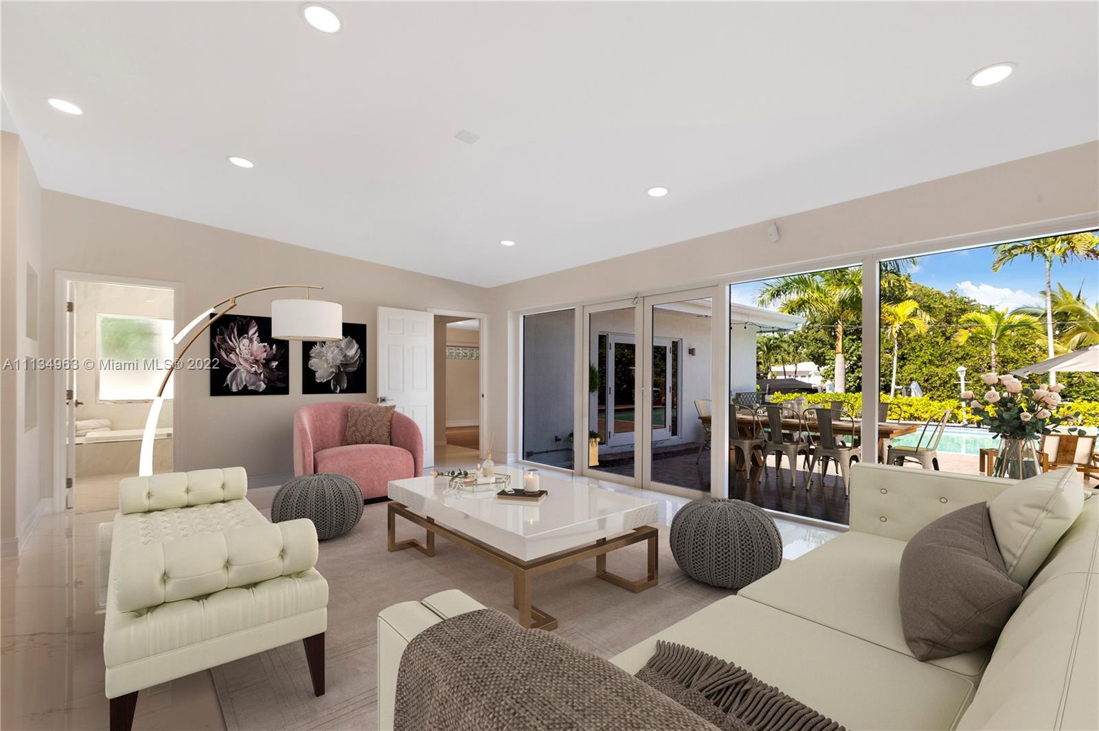 1777 Daytonia Road Miami Beach, FL 33141 - Photo 11 of 36 a living room with furniture and a large window