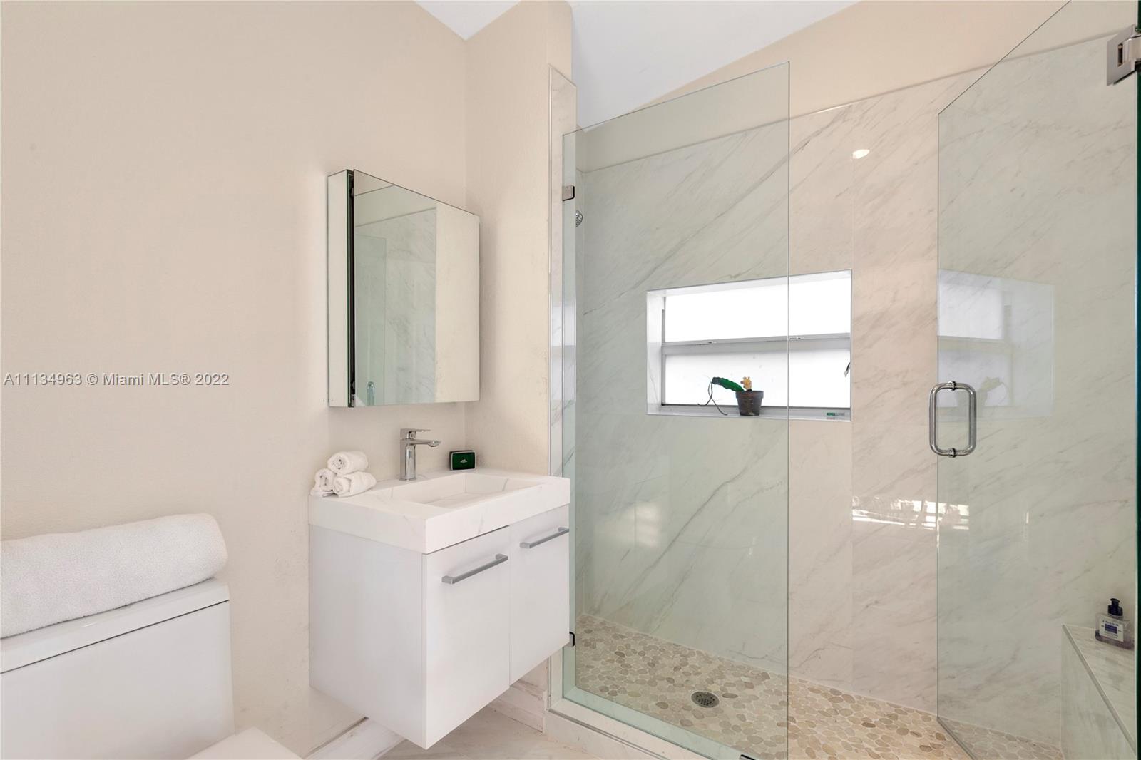1777 Daytonia Road Miami Beach, FL 33141 - Photo 23 of 36 a bathroom with a sink toilet and shower