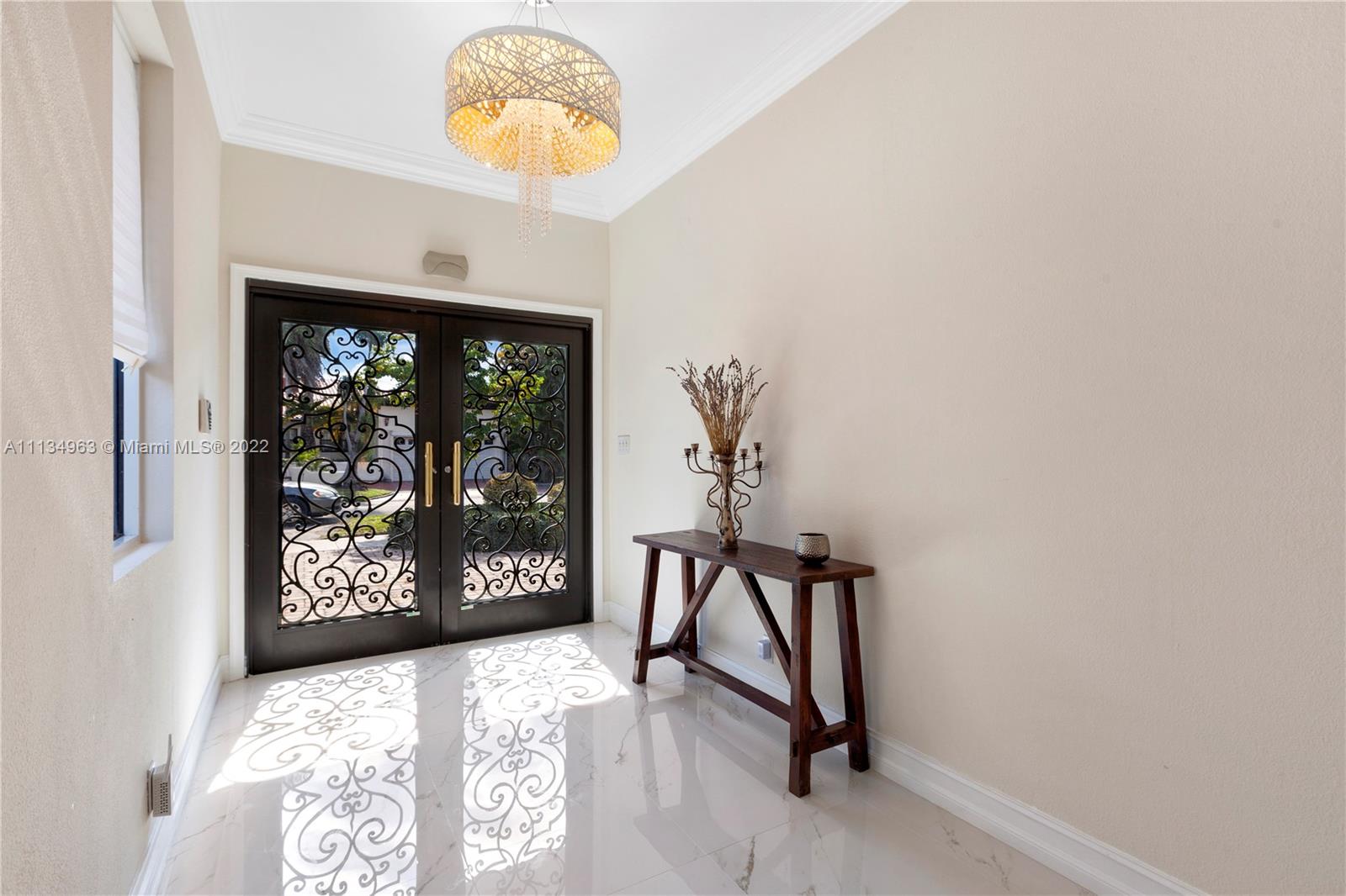 1777 Daytonia Road Miami Beach, FL 33141 - Photo 3 of 36 a view of entryway with a hallway