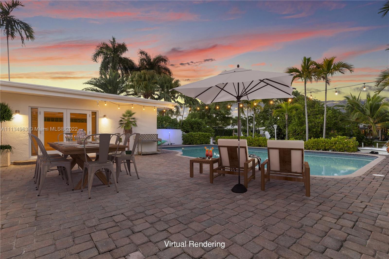 1777 Daytonia Road Miami Beach, FL 33141 - Photo 33 of 36 a view of a tables and chairs under an umbrella