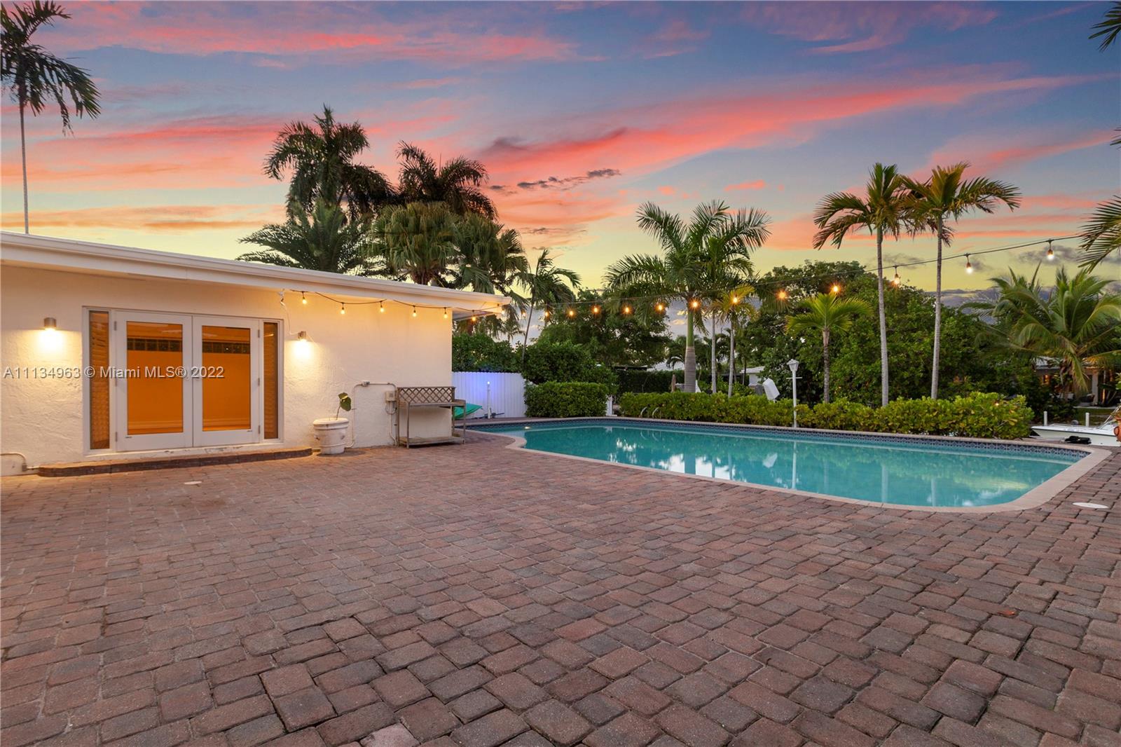 1777 Daytonia Road Miami Beach, FL 33141 - Photo 34 of 36 a view of a house with a yard and potted plants