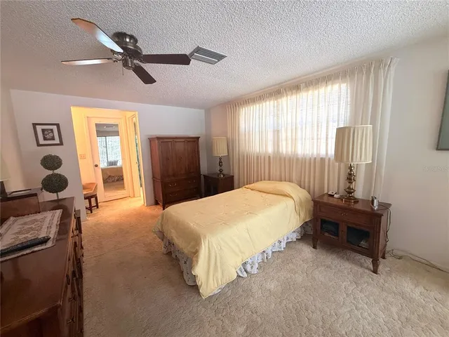 a bed room with a bed and a window