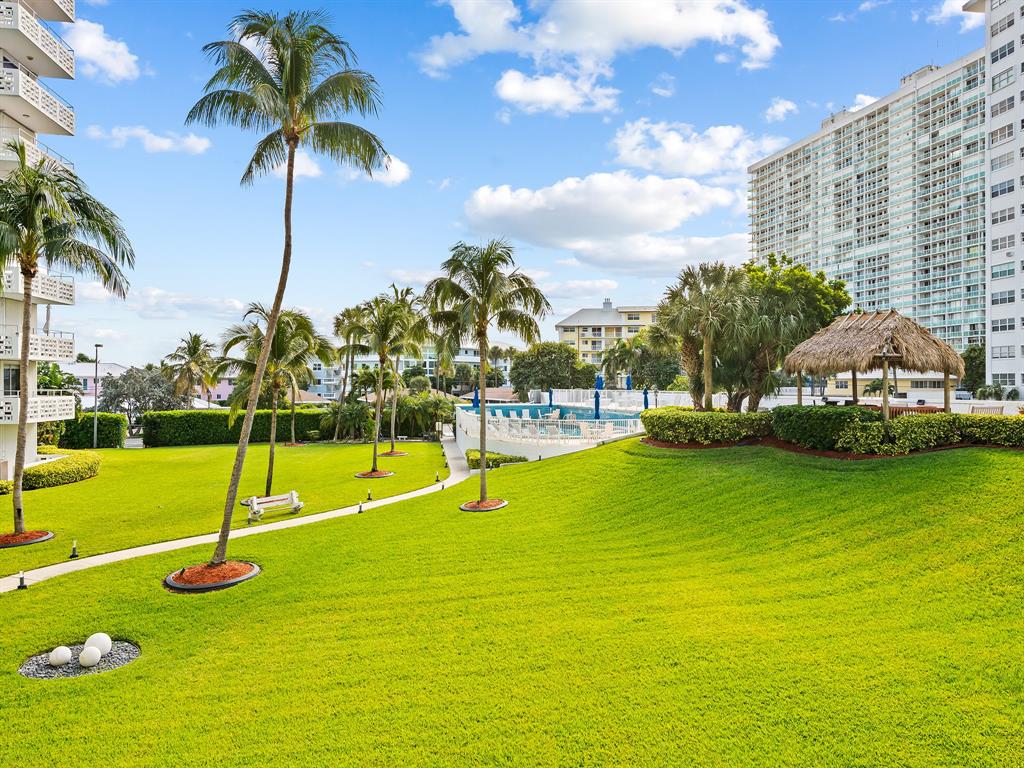 1900 South Ocean Drive, Unit 210 Fort Lauderdale, FL 33316 - Photo 25 of 31 a view of a swimming pool with a yard