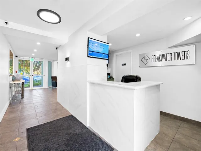 a view of a hallway with white walls