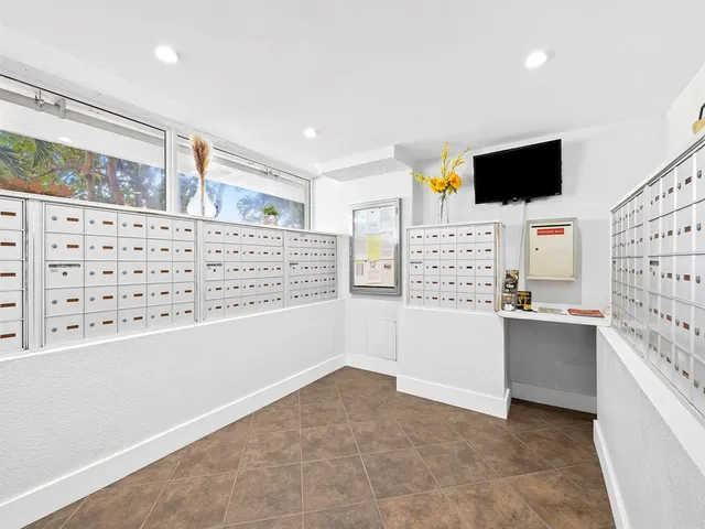 a view of swimming pool with outdoor seating and plants