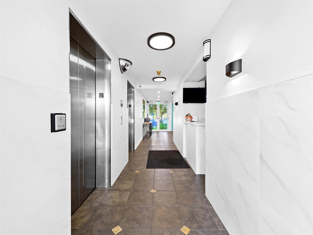 1900 South Ocean Drive, Unit 210 Fort Lauderdale, FL 33316 - Photo 29 of 31 a view of a hallway with white walls