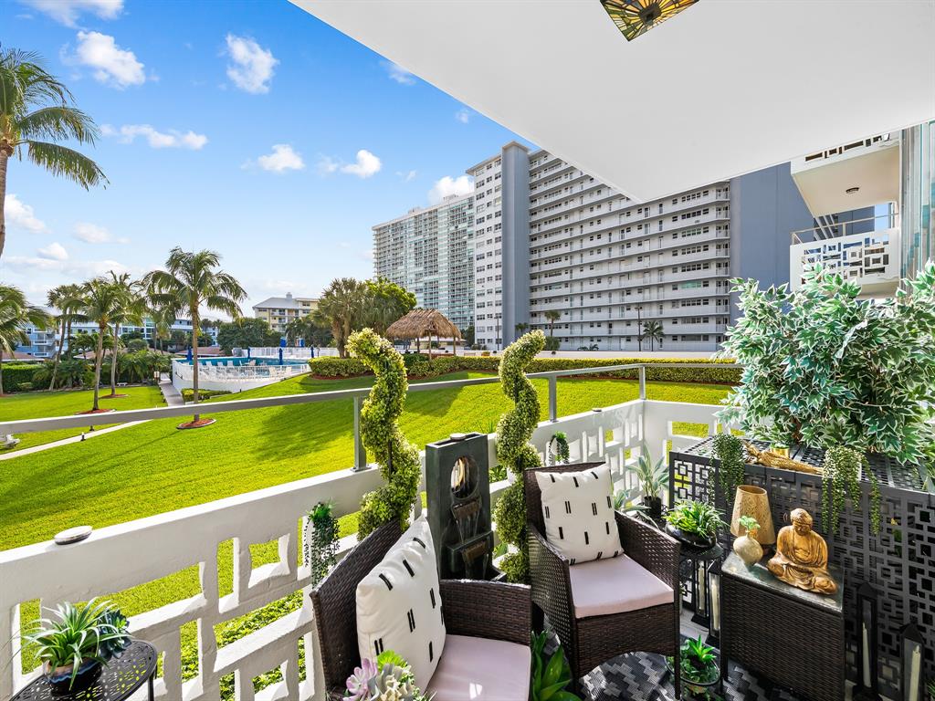 1900 South Ocean Drive, Unit 210 Fort Lauderdale, FL 33316 - Photo 31 of 31 a view of swimming pool with outdoor seating and plants