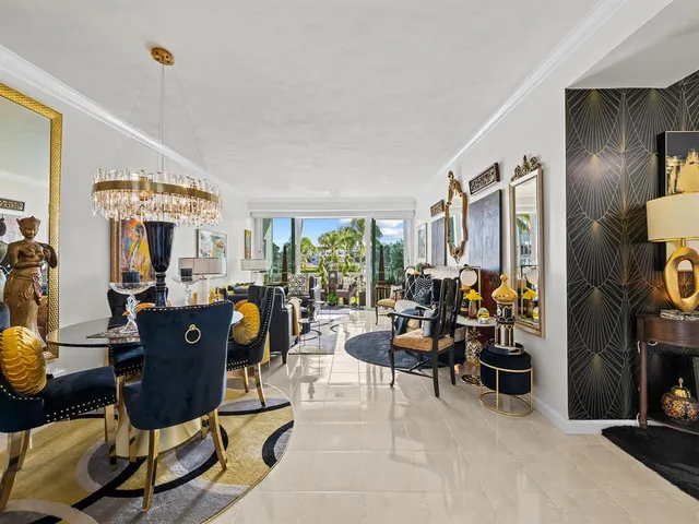 a view of a livingroom with furniture and bedroom