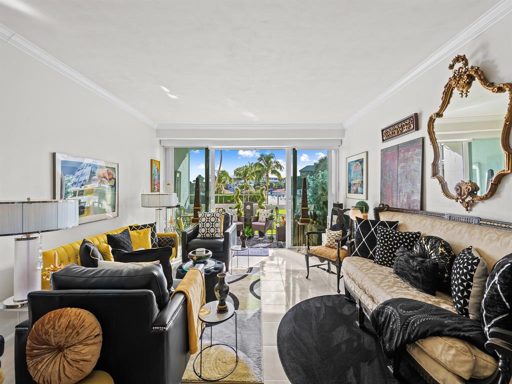 1900 South Ocean Drive, Unit 210 Fort Lauderdale, FL 33316 - Photo 9 of 31 a living room with furniture and a large window