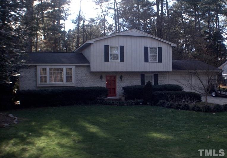 7605 Fiesta Way Raleigh, NC 27615 - Photo 1 of 1 a front view of a house with a yard