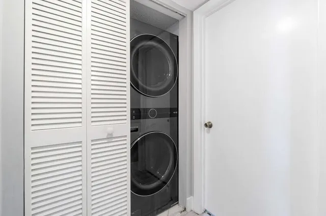 a view of a hallway with washer and dryer