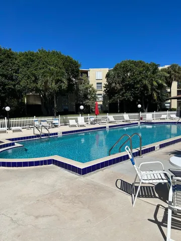 a view of a swimming pool with a lounge chair