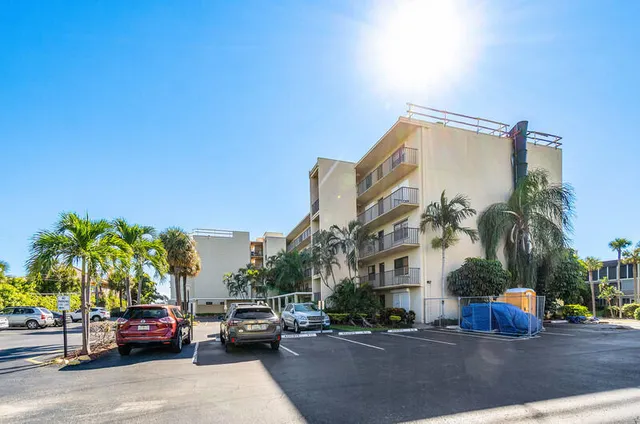 a view of a chair and table in the balcony