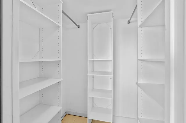 a view of an empty walk in closet
