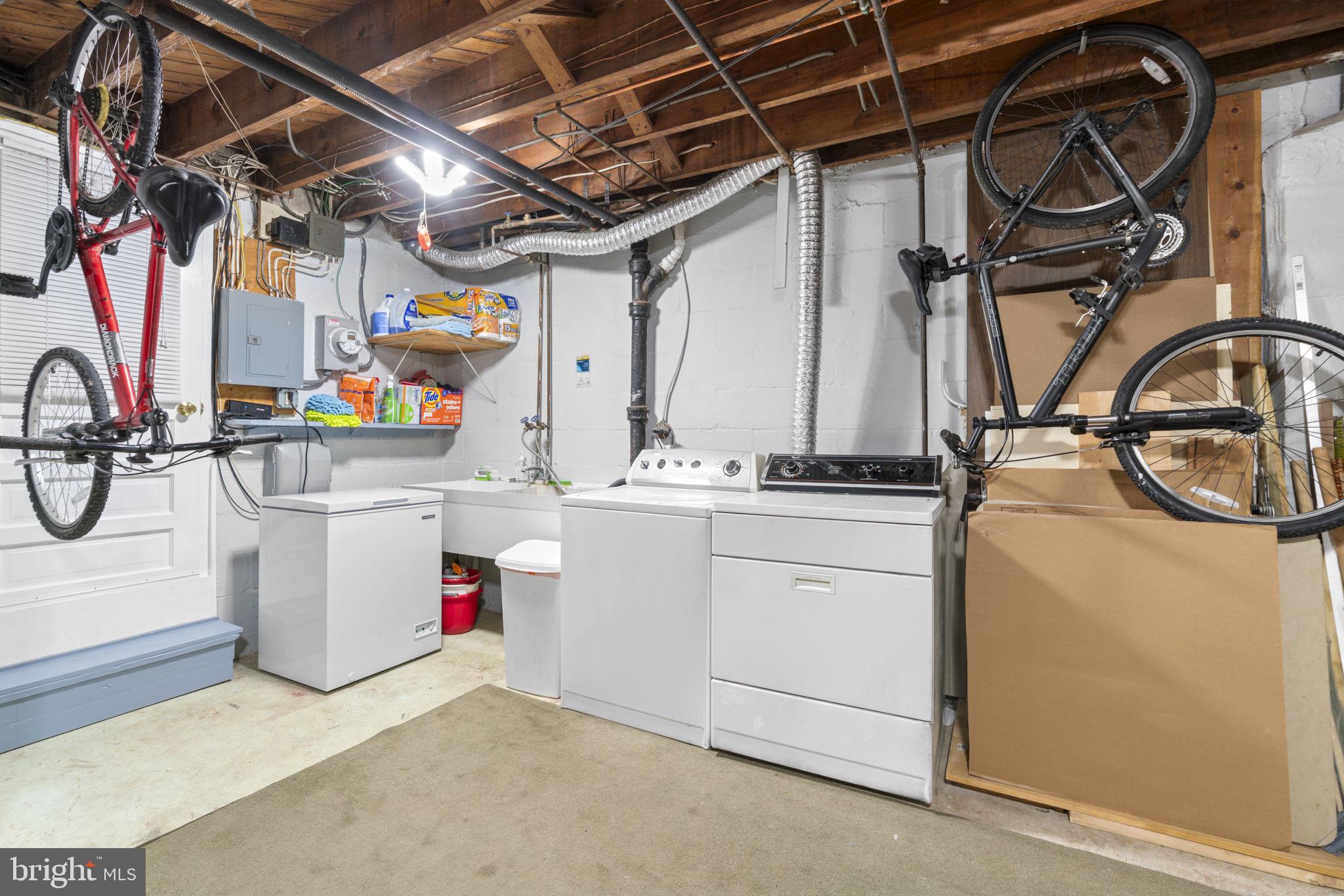 79 Murdock Road Baltimore, MD 21212 - Photo 22 of 38 Functional laundry space with bike storage.