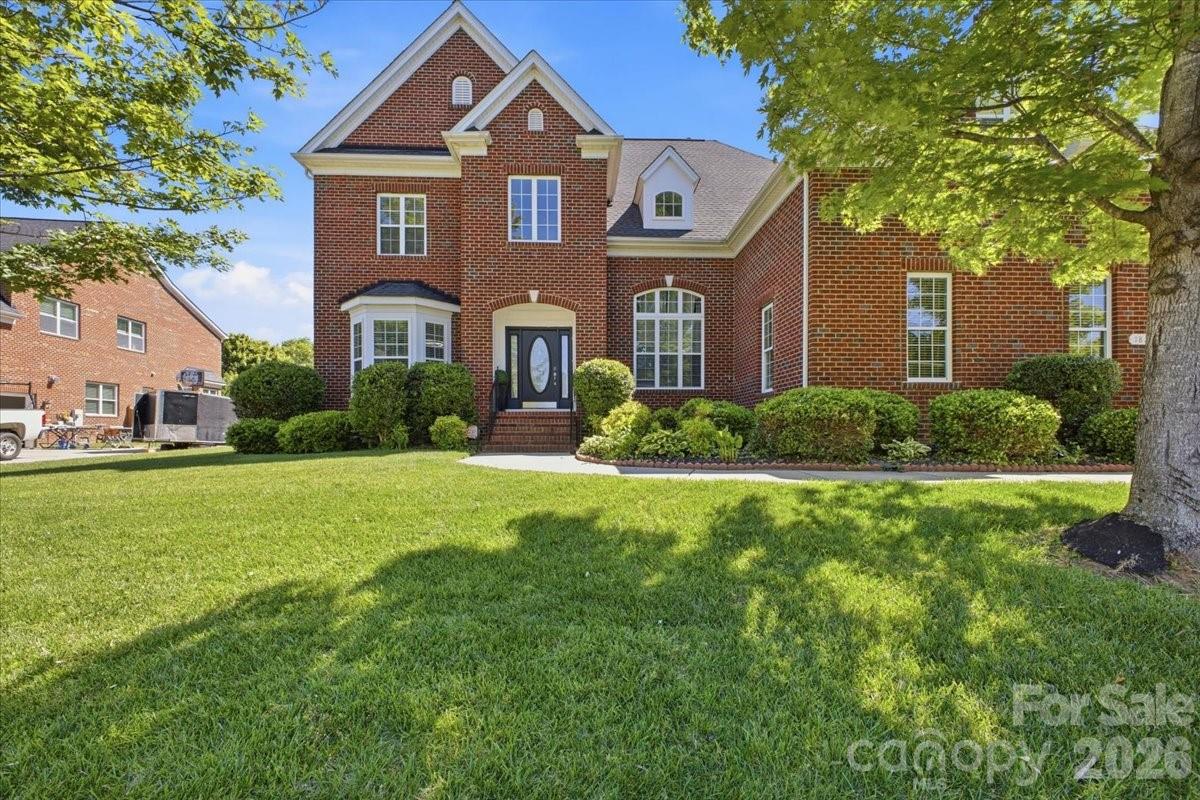 1825 Laveta Road Charlotte, NC 28269 - Photo 1 of 48 a front view of a house with a yard