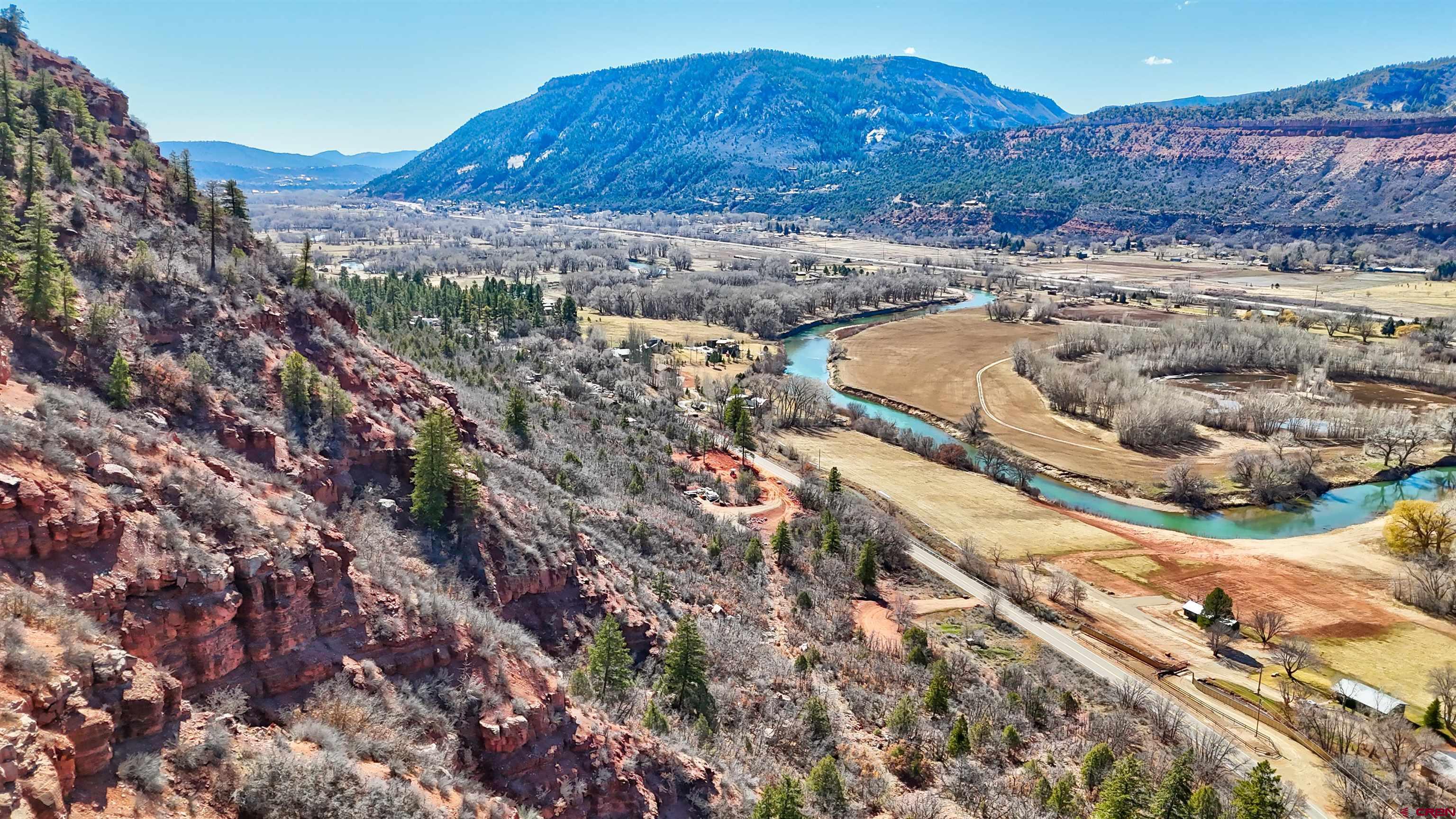 4228 County Road 250 Durango, CO 81301 - Photo 9 of 17 a view of a house with a mountain and a forest