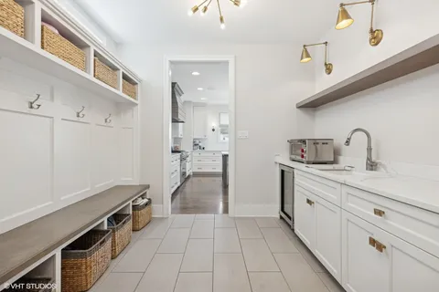 a kitchen with a sink and a stove top oven