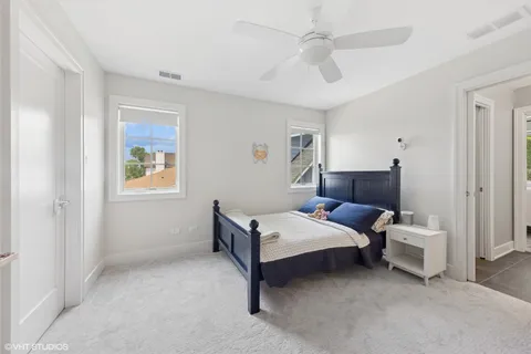 a living room with a bed furniture and a window