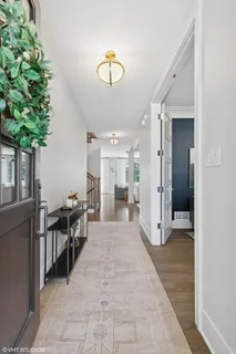 a view of a hallway that has a lot of furniture in it