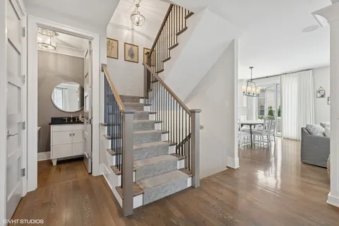 a view of entryway and hall with wooden floor