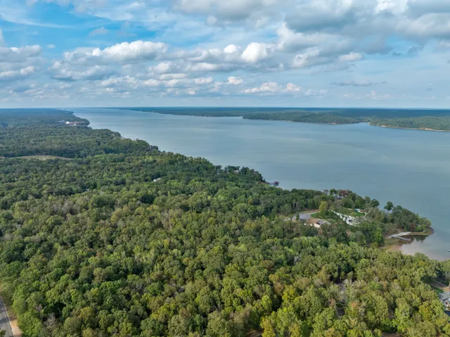 a view of a lake with a yard