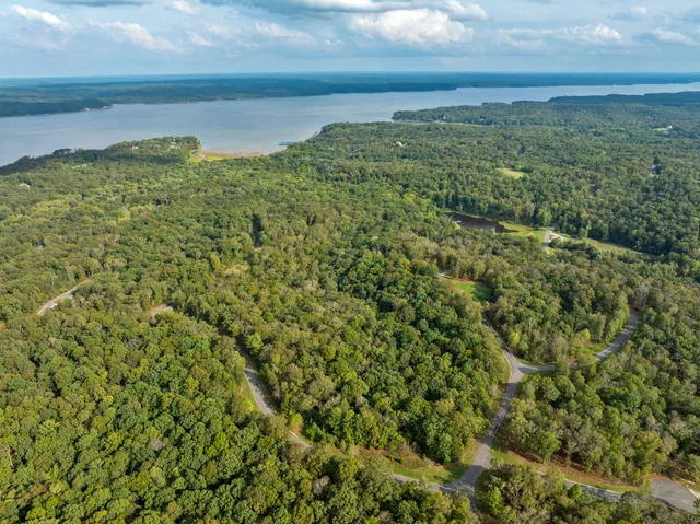 a view of a lake with a yard