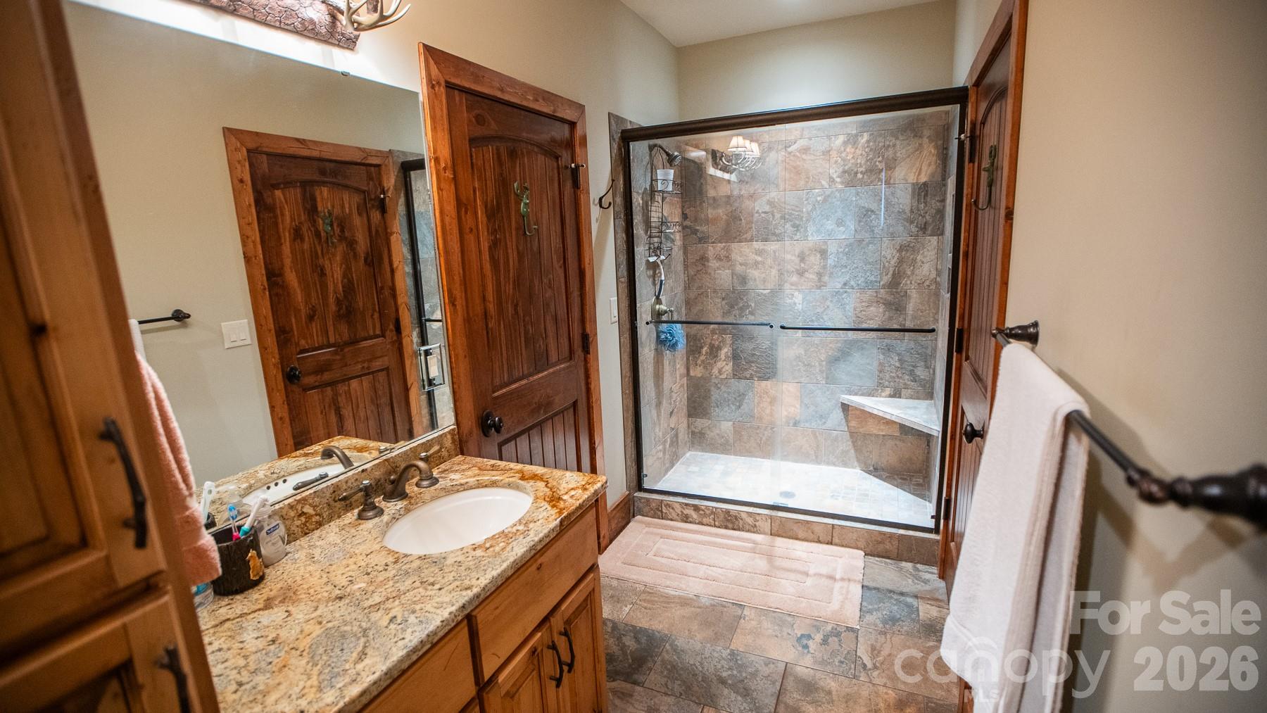530 Upright Road Mount Ulla, NC 28125 - Photo 23 of 48 a bathroom with a granite countertop sink and a mirror