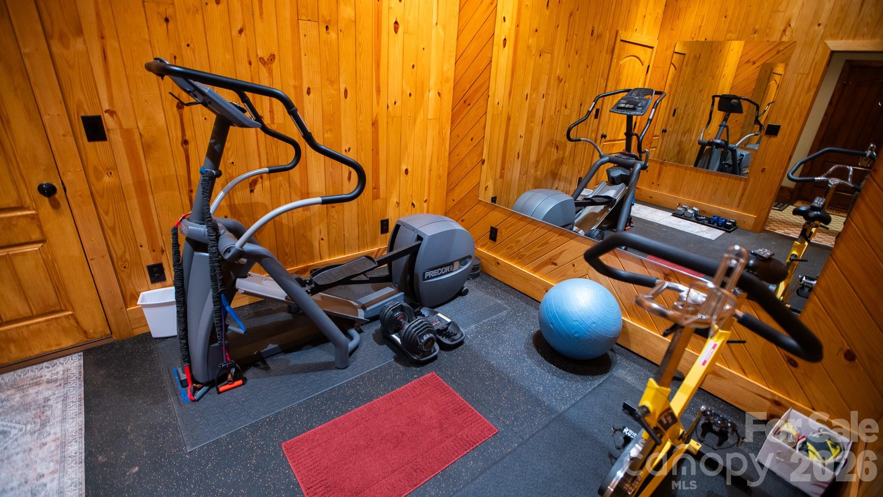 530 Upright Road Mount Ulla, NC 28125 - Photo 25 of 48 a room with gym equipment and wooden floor