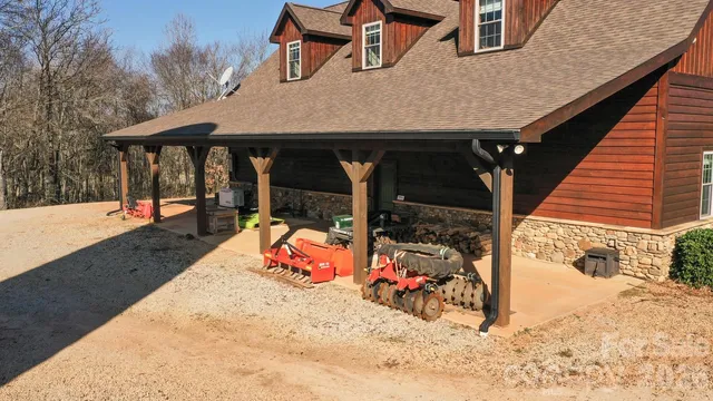 a view of a house with a yard porch and sitting area