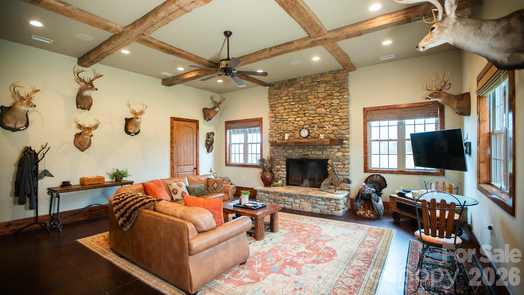 530 Upright Road Mount Ulla, NC 28125 - Photo 5 of 48 a living room with furniture a flat screen tv and a fireplace