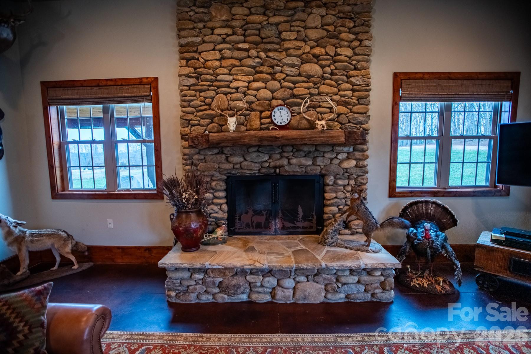 530 Upright Road Mount Ulla, NC 28125 - Photo 6 of 48 a bedroom with a bed a fireplace and wooden floor