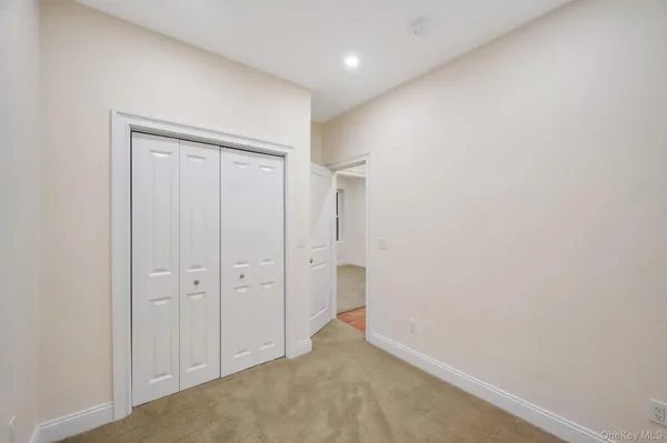 an empty room with closet area